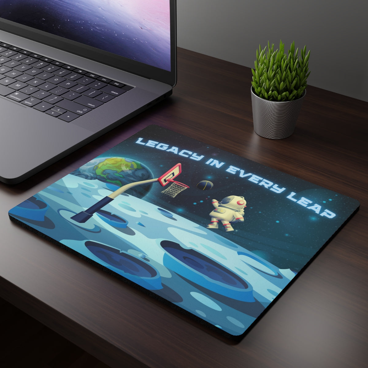 Creative workspace featuring Astronaut Basketball Mouse Pad with space-themed design