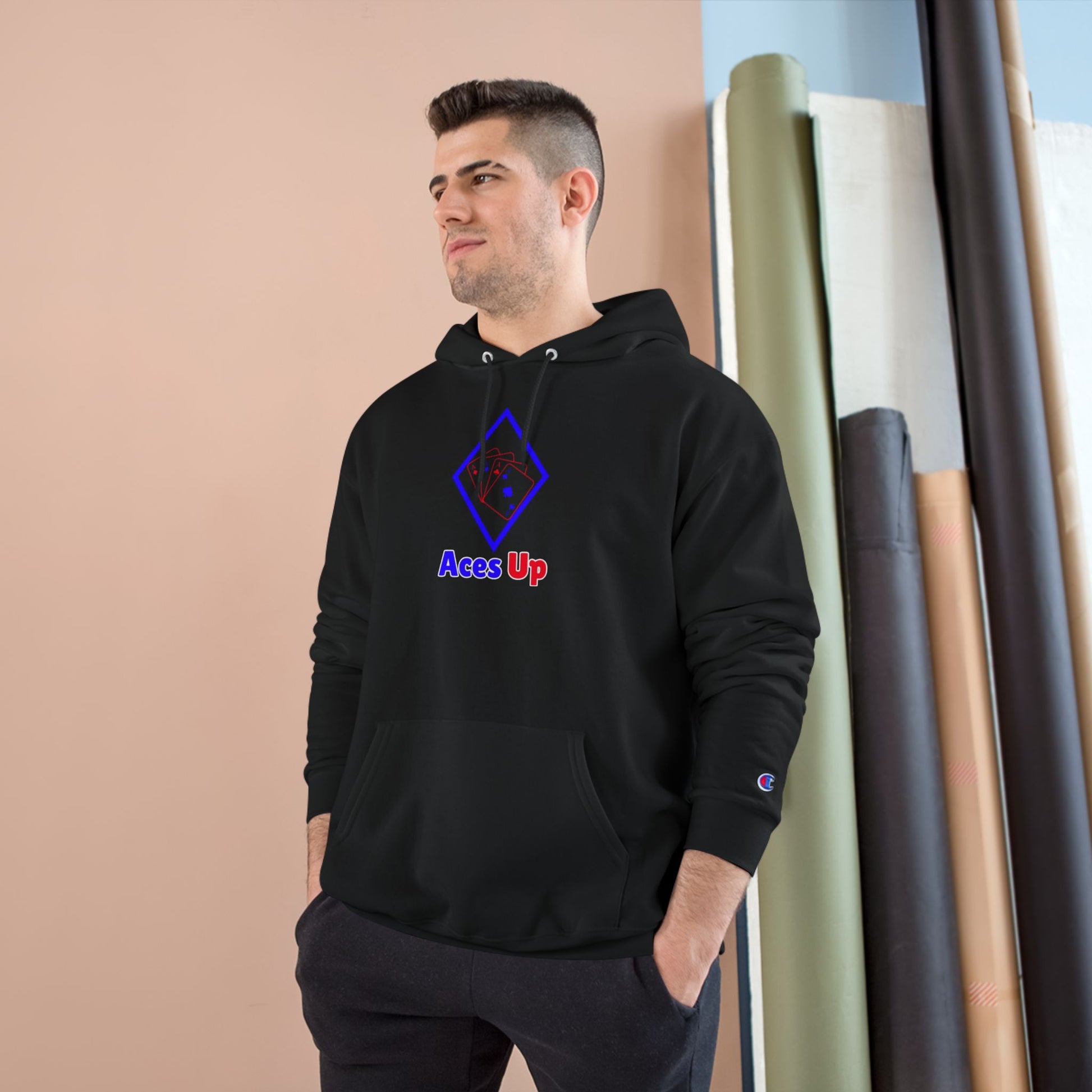 Stylish man wearing a Red Blue Diamond Ace Playing Cards Champion Hoodie, featuring 'Aces Up' design.