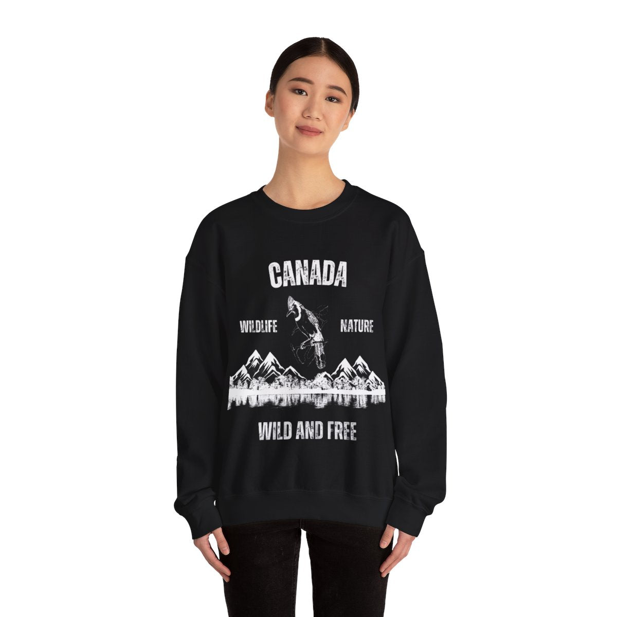 Woman wearing Canadian Wildlife Nature Wild and Free Sweatshirt outdoors in casual style