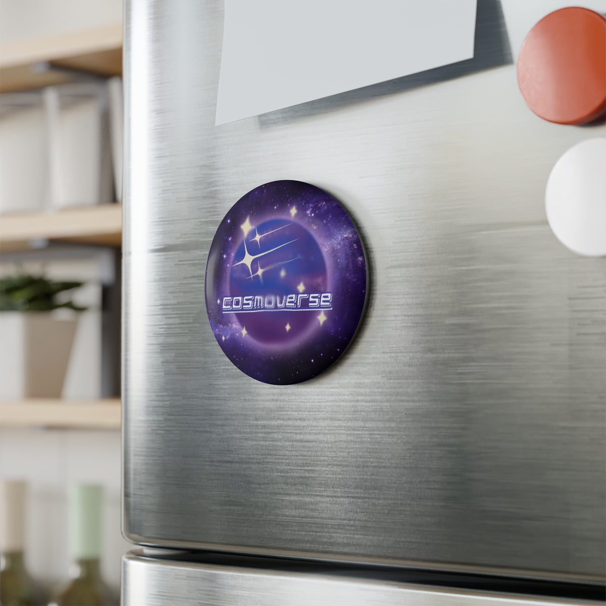 Cosmic Galaxy Button Magnet displayed on a refrigerator door in a kitchen setting