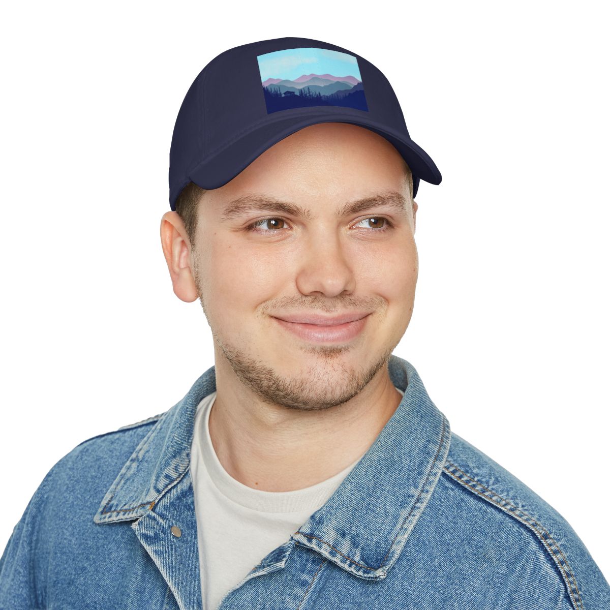 Second person modeling Navy Blue Mountain Landscape Cabin Cap in outdoor setting