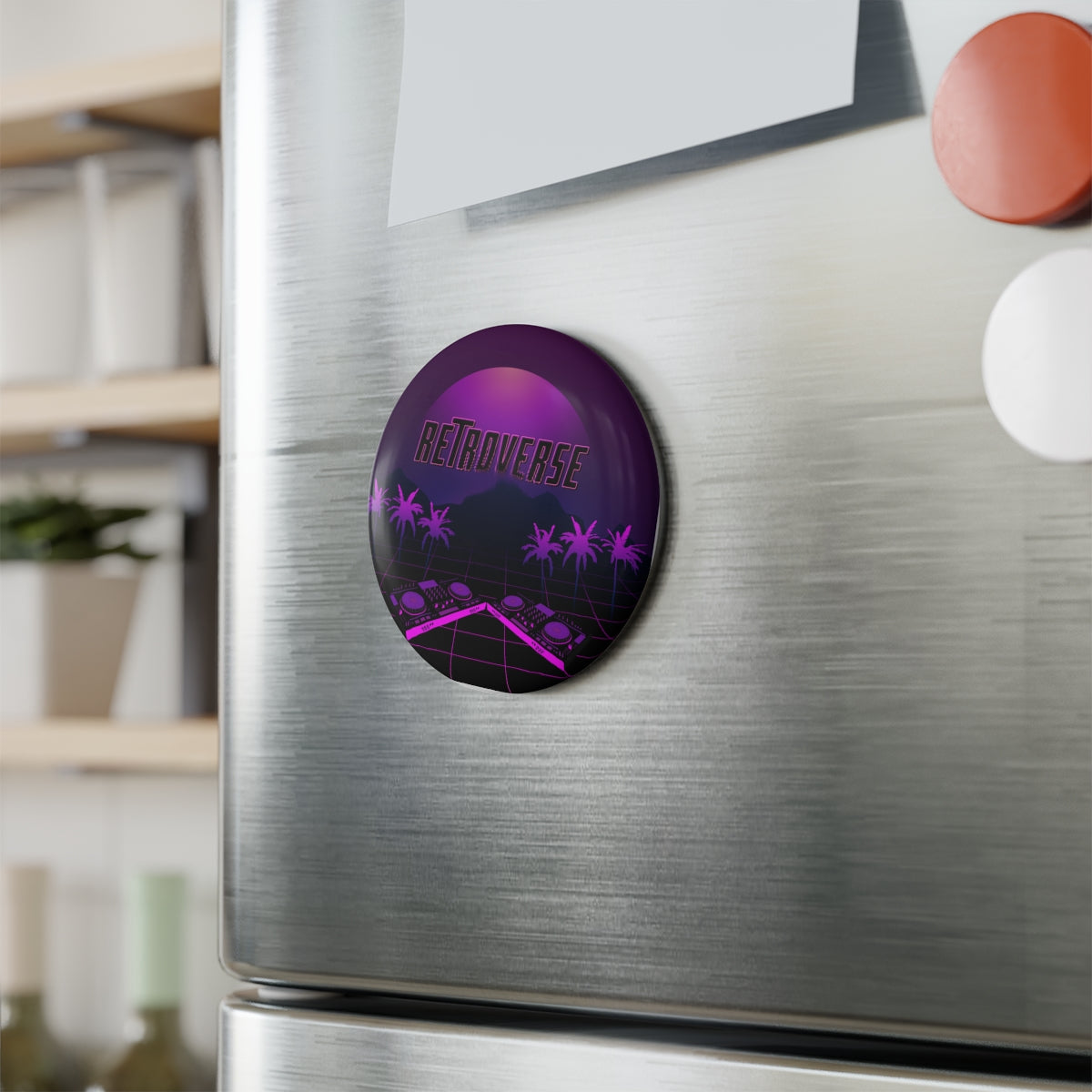 Retro 80s Button Magnet Sticker on a silver fridge door, adding colorful synthwave flair to the kitchen