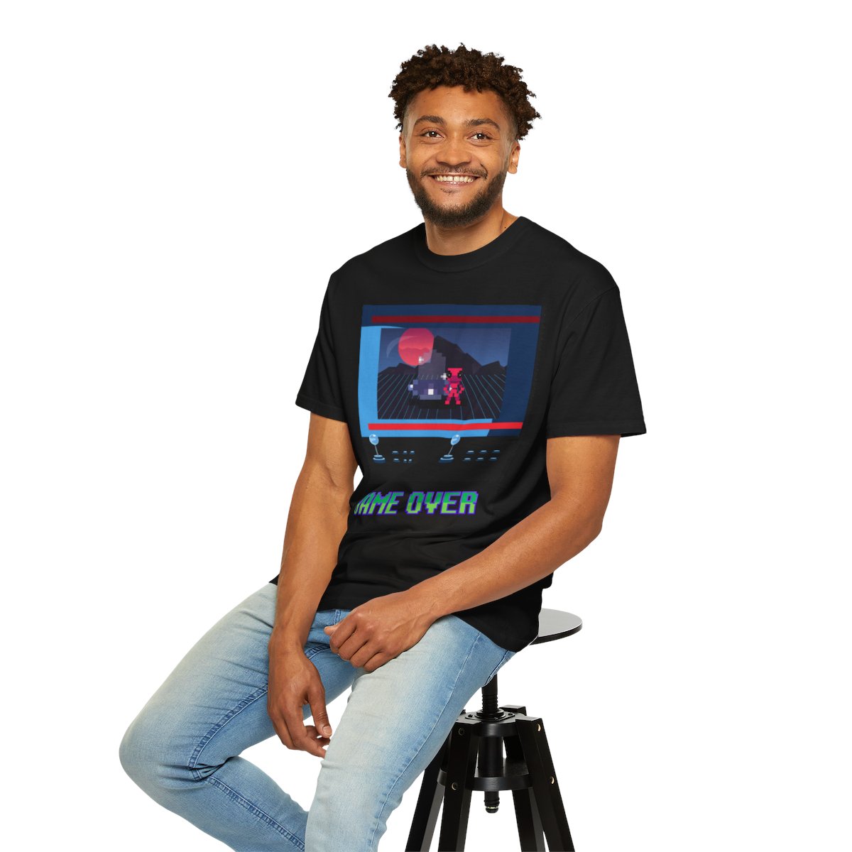 Man wearing Retro Video Game T-Shirt while sitting – classic video game shirt