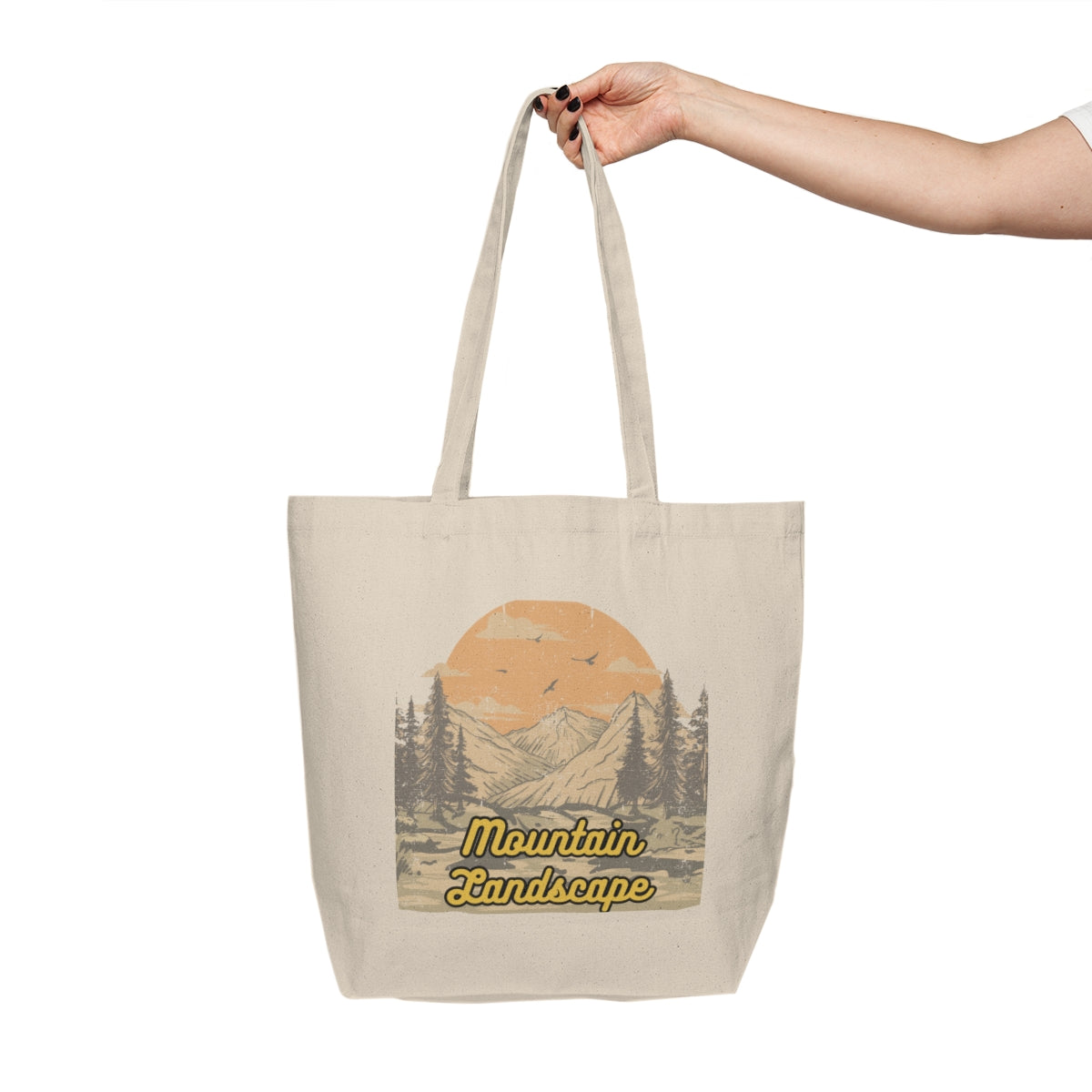 Person holding the Retro Sunset Mountain Tote Bag by the handles, showcasing the front design